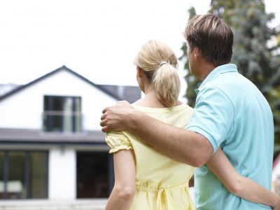 young-couple-looking-at-house-buying-a-home